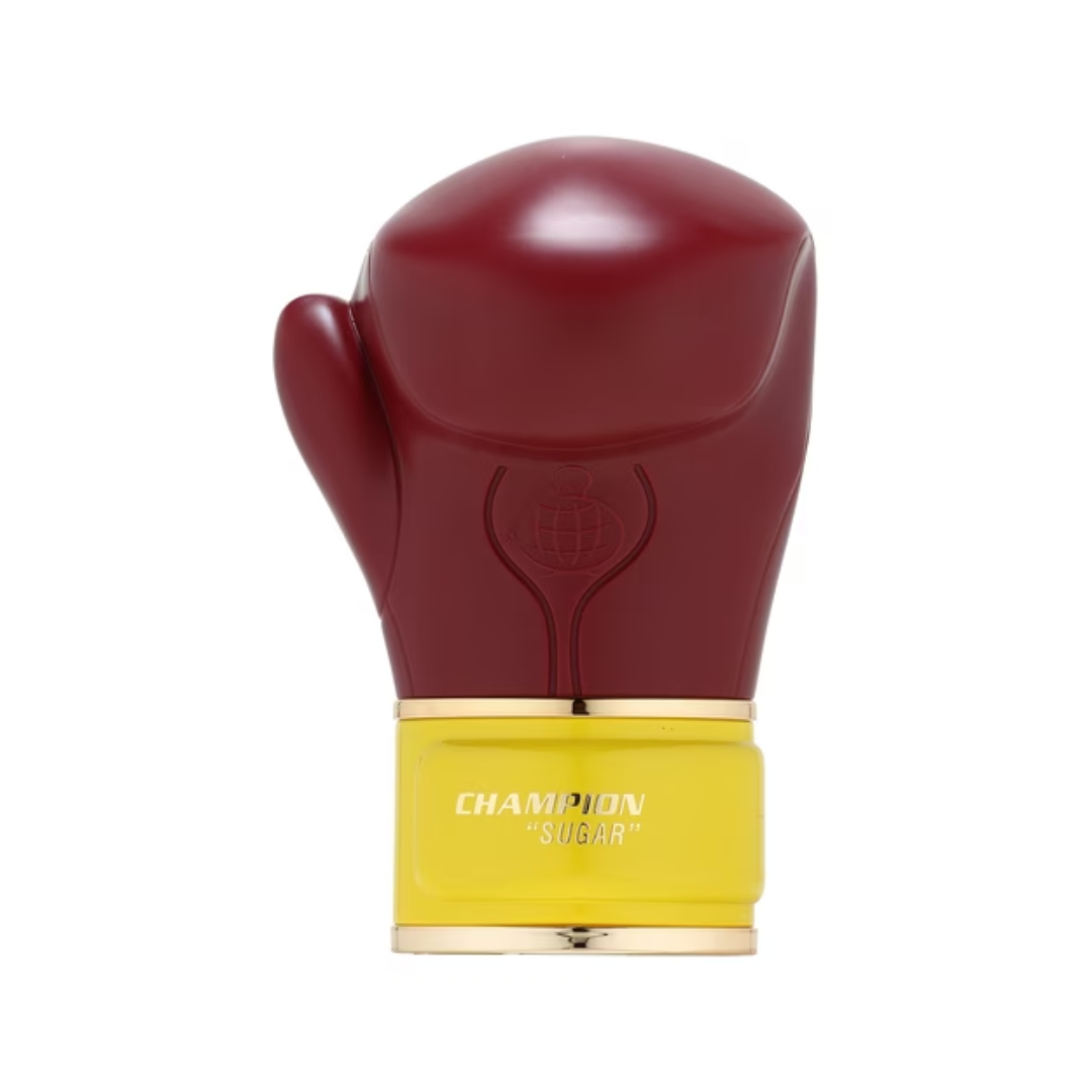 Fragrance World Champion Sugar Eau de Parfum 100ml in a unique boxing glove-shaped bottle with yellow and red accents.